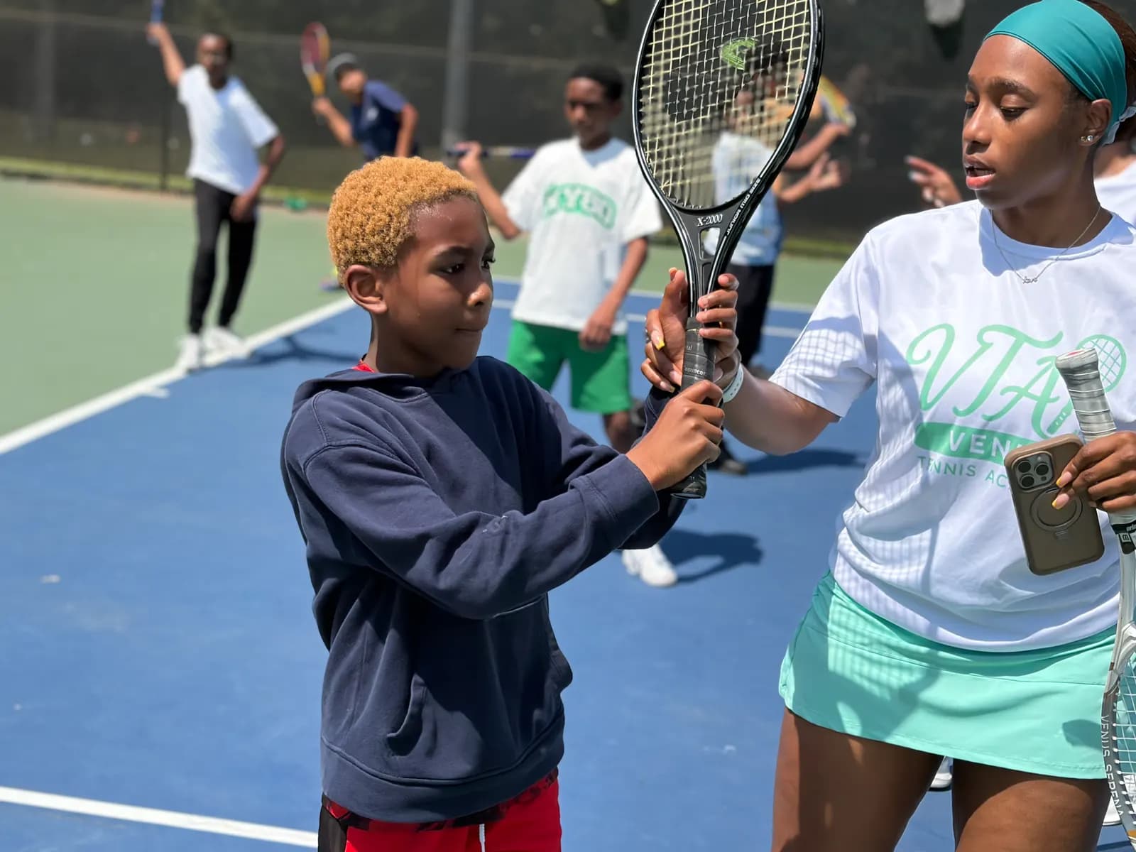 Young player learning tennis