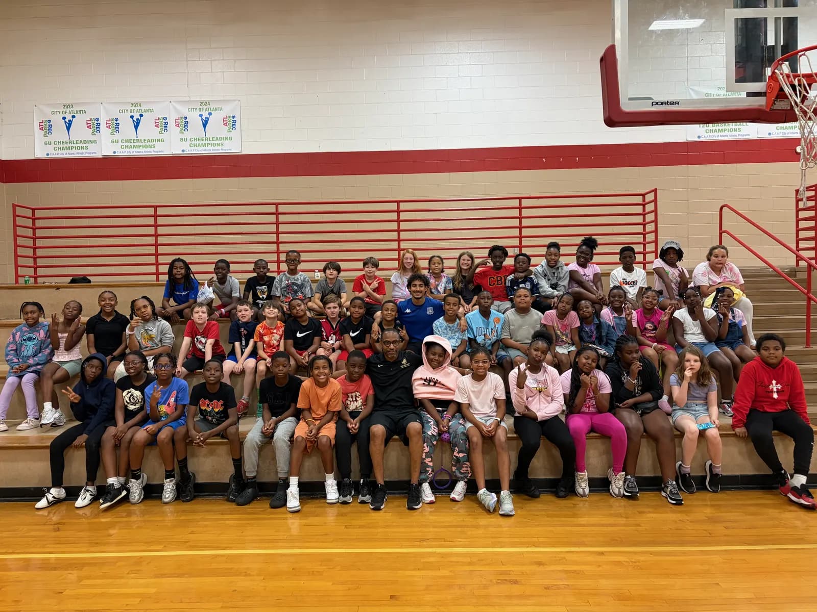Large group of children on the gym bleachers