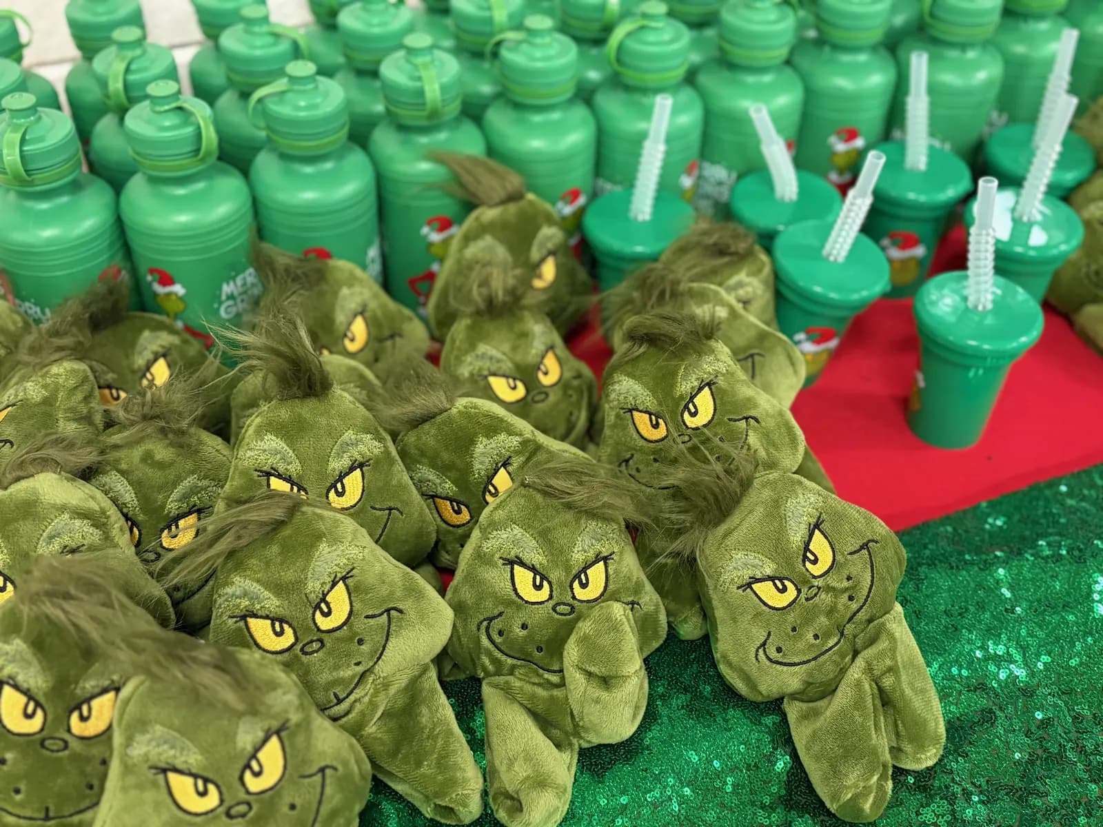 Grinch water bottles prepared for the Grinchmas drive