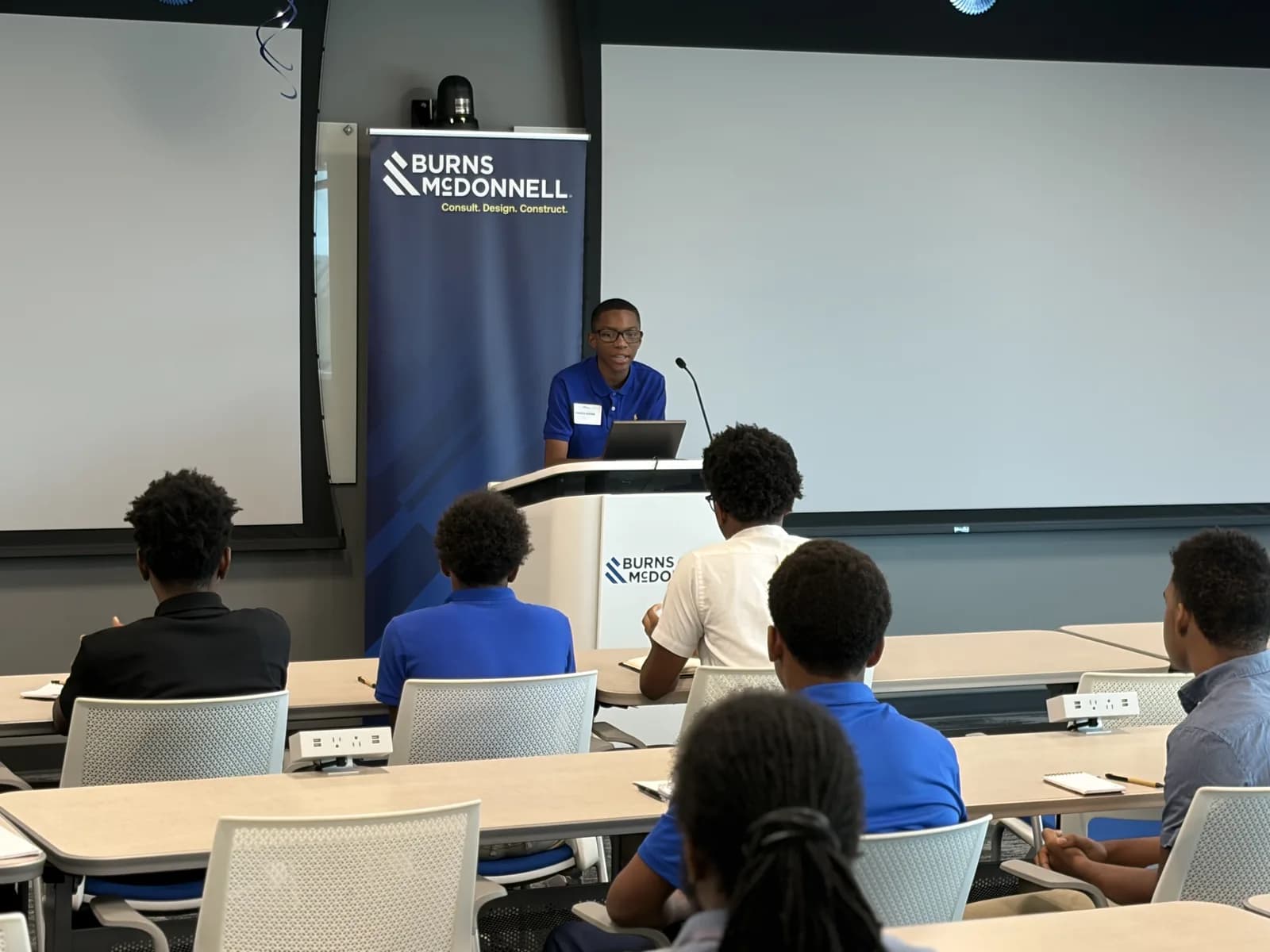 A presenter addressing students at the engineering camp
