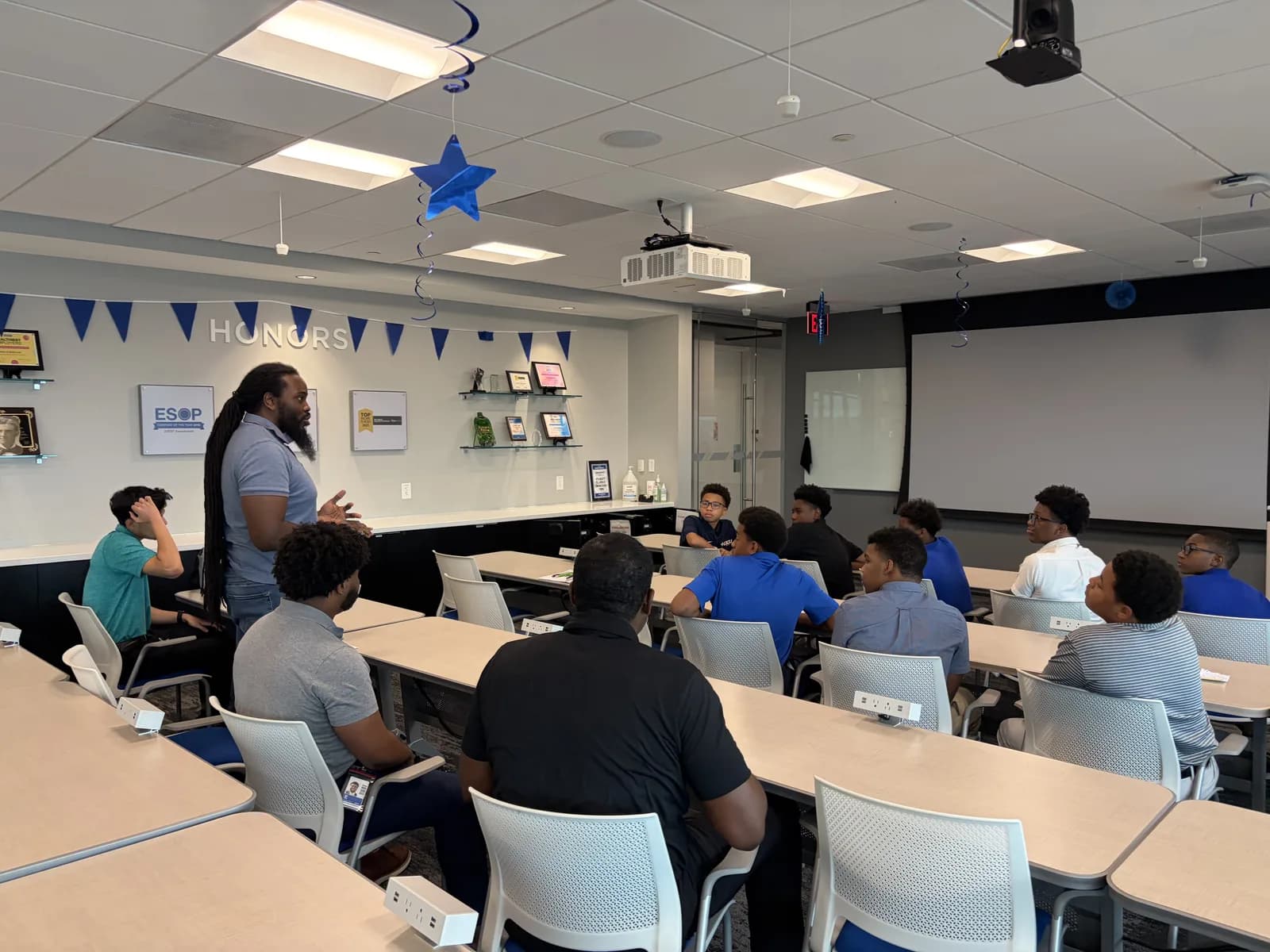 An instructor leading a classroom session at the engineering camp