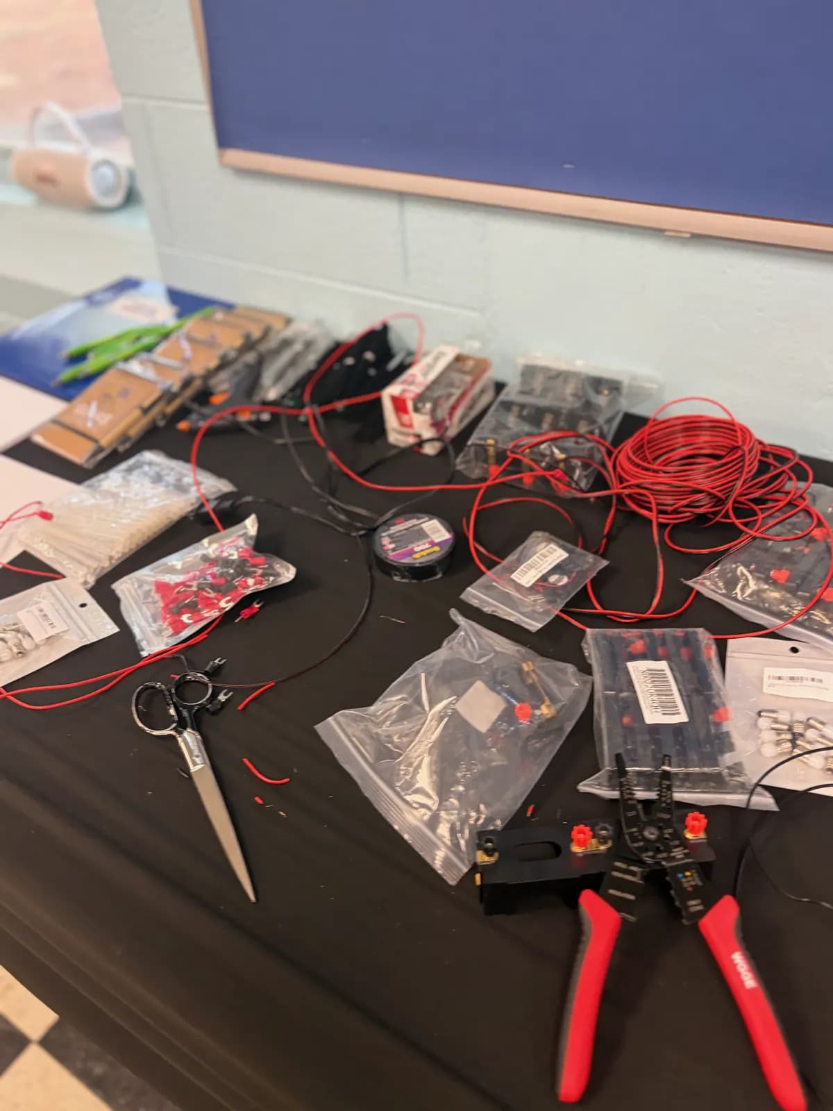 Electronics and wiring components laid out for a build